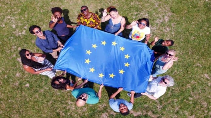 some teenagers waving the european union flag, Simbol of the Erasmus+ Programme